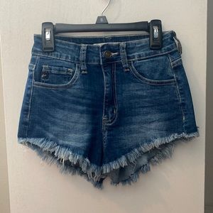 Brand new, dark wash, KanCan size 0/23 jean shorts.
